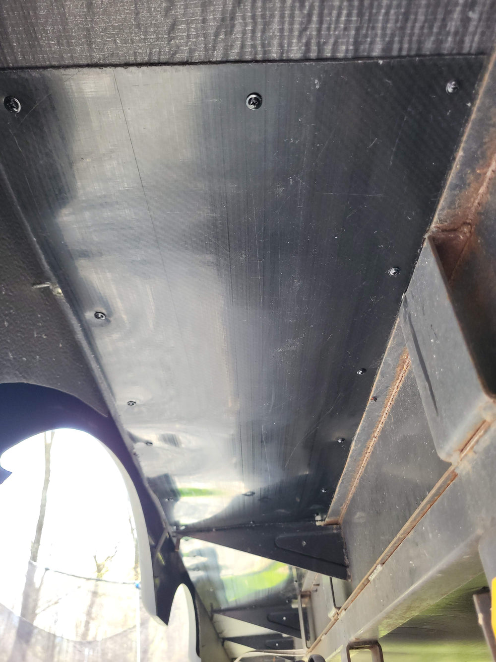 Titan Shield installed above RV wheels